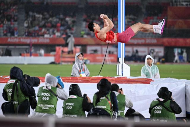 China's Yao Jie competes in the men's pole vault final during the 2026 Asian Games at Nagoya City Mizuho Park Athletic Stadium in Nagoya, Aichi Prefecture on September 29, 2026. (Photo by MOHD RASFAN / AFP)