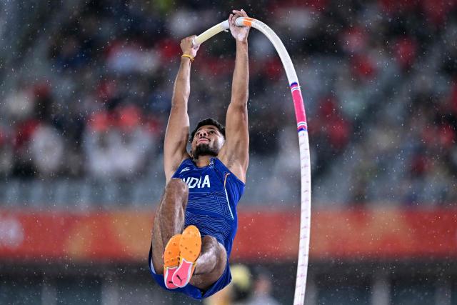 India's Dev Kumar Meena competes in the men's pole vault final during the 2026 Asian Games at Nagoya City Mizuho Park Athletic Stadium in Nagoya, Aichi Prefecture on September 29, 2026. (Photo by MOHD RASFAN / AFP)