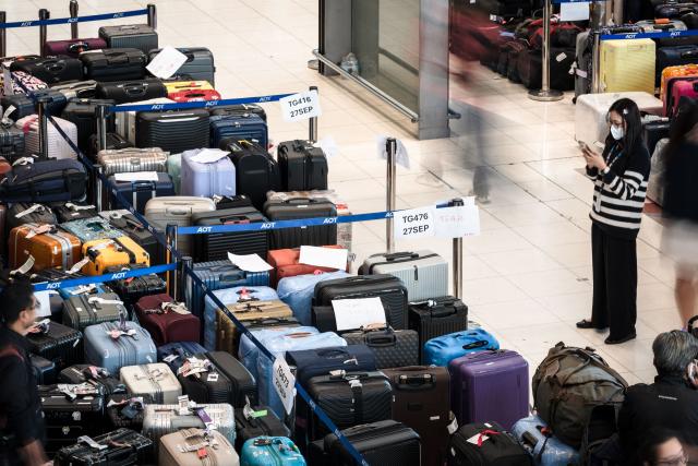 Passenger's baggage from Thai Airways flights is seen at Suvarnabhumi International Airport in Bangkok on September 29, 2026, after flooding disrupted the airline's ground services. More than 500,000 households and 1.7 million people across 27 provinces have been impacted by floods in Thailand after an intense weather system hit the region, the government said. (Photo by AFP)