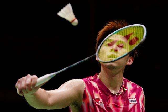 Thailand's Kunlavut Vitidsarn hits a return against Singapore's Loh Kean Yew during the men's singles badminton final during the 2026 Asian Games at the Ichinomiya City Municipal Gymnasium in Ichinomiya, Aichi prefecture on September 29, 2026. (Photo by Yuichi YAMAZAKI / AFP)