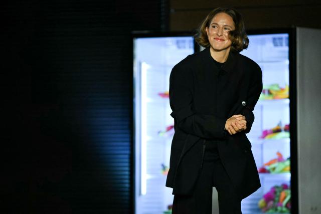 Belgian designer Marie Adam-Leenaerdt acknowledges the audience at the end of the Marie Adam-Leenaerdt Women's Spring/Summer 2027 collection fashion show as part of the Paris Fashion Week, in Paris on September 29, 2026. (Photo by LOU BENOIST / AFP)