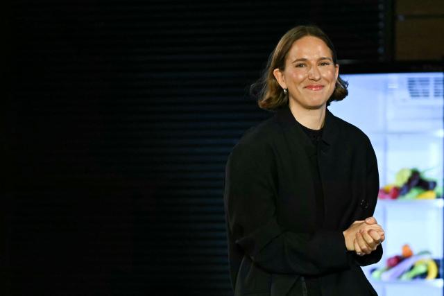 Belgian designer Marie Adam-Leenaerdt acknowledges the audience at the end of the Marie Adam-Leenaerdt Women's Spring/Summer 2027 collection fashion show as part of the Paris Fashion Week, in Paris on September 29, 2026. (Photo by LOU BENOIST / AFP)