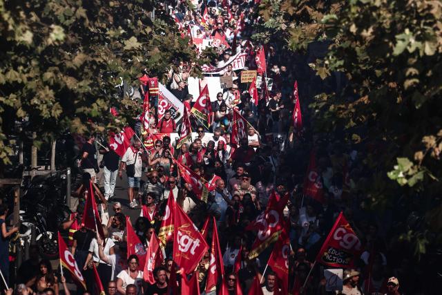 Protesters march with CGT unions' flags during a day of nationwide public sector strikes and demonstrations, in Marseille, on September 29, 2026. Public sector workers, including firefighters, hold a one-day strike and demonstrations across France on September 29 in response to a call from a broad inter-union coalition, with the aim of putting pressure on the government two days before the presentation of the draft budget for 2027. (Photo by Thibaud MORITZ / AFP)