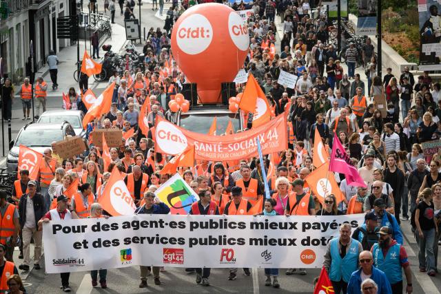 Protesters take part in a rally during a day of nationwide public sector strikes and demonstrations, in Nantes, western France, on September 29, 2026. Public sector workers, including firefighters, hold a one-day strike and demonstrations across France on September 29 in response to a call from a broad inter-union coalition, with the aim of putting pressure on the government two days before the presentation of the draft budget for 2027. (Photo by Loic VENANCE / AFP)