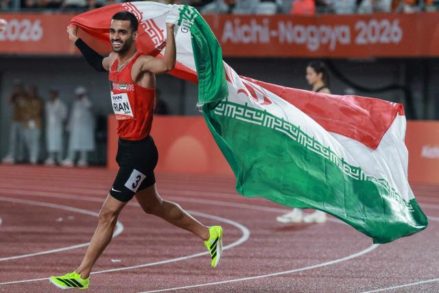 Iran's Ali Amirian celebrates finishing second in the men's 800m final during the 2026 Asian Games at Nagoya City Mizuho Park Athletic Stadium in Nagoya, Aichi Prefecture on September 29, 2026. (Photo by DAVID GRAY / AFP)