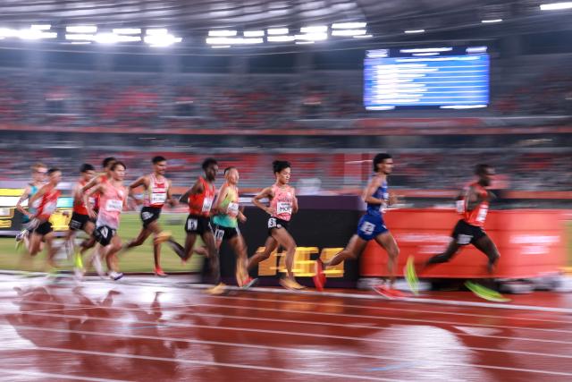Athletes compete in the men's 5000m final during the 2026 Asian Games at Nagoya City Mizuho Park Athletic Stadium in Nagoya, Aichi Prefecture on September 29, 2026. (Photo by DAVID GRAY / AFP)