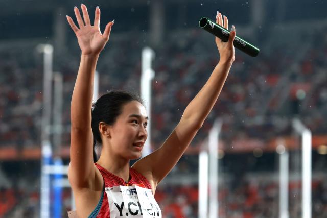 China's Chen Yujie celebrates winning the mixed 4x100m relay final during the 2026 Asian Games at Nagoya City Mizuho Park Athletic Stadium in Nagoya, Aichi Prefecture on September 29, 2026. (Photo by DAVID GRAY / AFP)