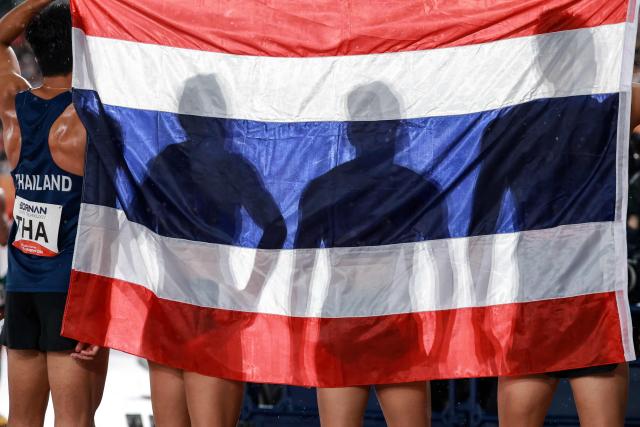 Members of Thailand's mixed 4x100m relay team celebrate finishing second in their final during the 2026 Asian Games at Nagoya City Mizuho Park Athletic Stadium in Nagoya, Aichi Prefecture on September 29, 2026. (Photo by DAVID GRAY / AFP)