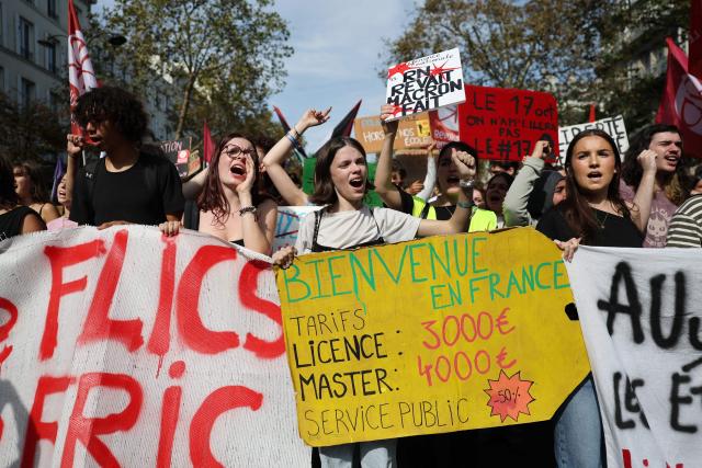 High school students march with a placard during a rally as part of a day of nationwide public sector strikes and demonstrations, in Paris, on September 29, 2026. Public sector workers, including firefighters, hold a one-day strike and demonstrations across France on September 29 in response to a call from a broad inter-union coalition, with the aim of putting pressure on the government two days before the presentation of the draft budget for 2027. (Photo by Anne-Christine POUJOULAT / AFP)