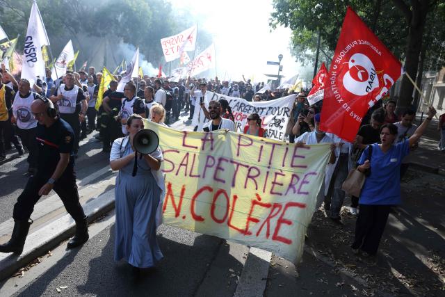 Protesters from hospital staff join the firefighters during their rally to demand additional resources, following a summer of record-breaking wildfires, at Place de la Bastille in Paris, on September 29, 2026. Public sector workers, including firefighters, hold a one-day strike and demonstrations across France on September 29 in response to a call from a broad inter-union coalition, with the aim of putting pressure on the government two days before the presentation of the draft budget for 2027. (Photo by Kenzo TRIBOUILLARD / AFP)