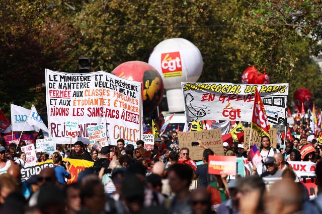 Protesters march with placards and CGT union's flags during a rally as part of a day of nationwide public sector strikes and demonstrations, in Paris, on September 29, 2026. Public sector workers, including firefighters, hold a one-day strike and demonstrations across France on September 29 in response to a call from a broad inter-union coalition, with the aim of putting pressure on the government two days before the presentation of the draft budget for 2027. (Photo by Anne-Christine POUJOULAT / AFP)
