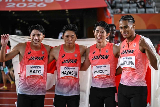 Japan's Fuga Sato, Japan's Shinya Hayashi, Japan's Kenki Imaizumi and Japan's Yuki Joseph Nakajima celebrate winning the men's 4x400m relay final during the 2026 Asian Games at Nagoya City Mizuho Park Athletic Stadium in Nagoya, Aichi Prefecture on September 29, 2026. (Photo by MOHD RASFAN / AFP)