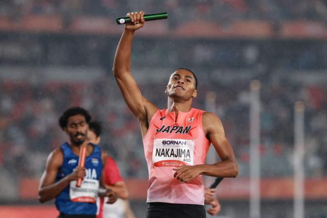 Japan's Yuki Joseph Nakajima celebrates winning the men's 4x400m relay final during the 2026 Asian Games at Nagoya City Mizuho Park Athletic Stadium in Nagoya, Aichi Prefecture on September 29, 2026. (Photo by DAVID GRAY / AFP)