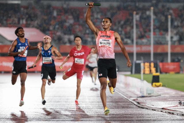 Japan's Yuki Joseph Nakajima celebrates winning the men's 4x400m relay final during the 2026 Asian Games at Nagoya City Mizuho Park Athletic Stadium in Nagoya, Aichi Prefecture on September 29, 2026. (Photo by DAVID GRAY / AFP)