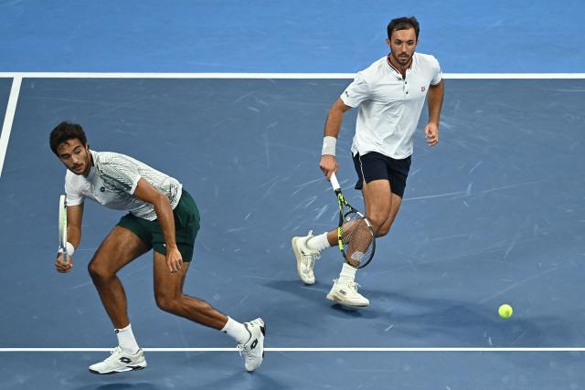 Portugal’s Francisco Cabral (L) and USA’s JJ Tracy play a point during their men’s doubles final against Netherlands’ Sander Arends and David Pel at the Hangzhou Open tennis tournament in Hangzhou, in China’s eastern Zhejiang province on September 29, 2026. (Photo by AFP) / China OUT