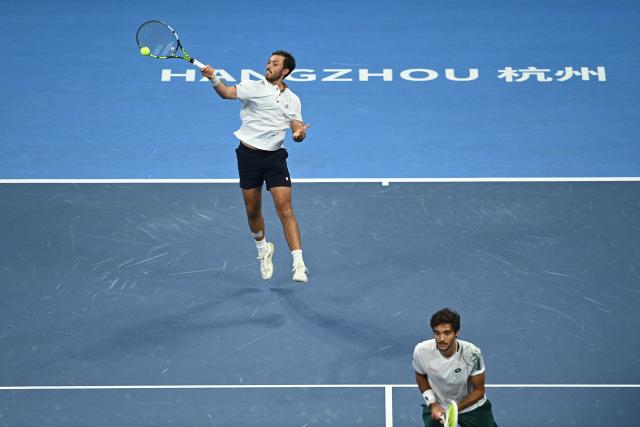 Portugal’s Francisco Cabral (R) and USA’s JJ Tracy (L) play a point during their men’s doubles final against Netherlands’ Sander Arends and David Pel at the Hangzhou Open tennis tournament in Hangzhou, in China’s eastern Zhejiang province on September 29, 2026. (Photo by AFP) / China OUT