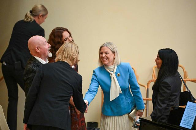 Sweden's Social Democratic Party leader Magdalena Andersson (2nd R) shakes hands as she attends the opening of the Swedish Parliament Riksdagen on September 29, 2026 in Stockholm, as the parliament meets for the first plenary session after the general elections. (Photo by Jonathan NACKSTRAND / AFP)