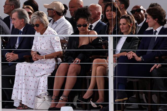 (1st row - From L) LVMH chairman and CEO Bernard Arnault, French-Canadian pianist Helene Mercier-Arnault, Barbadian singer Rihanna, French actress Camille Cottin and Louis Vuitton Watch Director Jean Arnault look on ahead of the Christian Dior Women's Spring/Summer 2027 collection fashion show as part of the Paris Fashion Week, in Paris on September 29, 2026. (Photo by SIMON WOHLFAHRT / AFP)