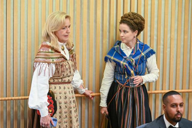 The Green Party's spokesperson Amanda Lind (R) speaks with Centre Party leader Elisabeth Thand Ringqvist as they attend the opening of the Swedish Parliament Riksdagen on September 29, 2026 in Stockholm, as the parliament meets for the first plenary session after the general elections. (Photo by Jonathan NACKSTRAND / AFP)