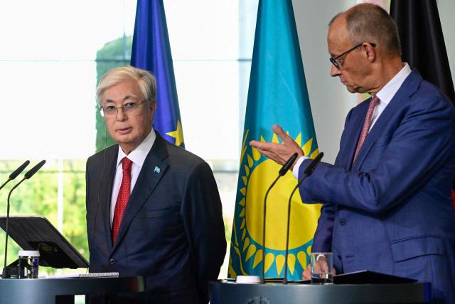 German Chancellor Friedrich Merz (R) gestures to Kazakhstan's President Kassym-Jomart Tokayev as they address a press conference at the Chancellery in Berlin on September 29, 2026. (Photo by John MACDOUGALL / AFP)