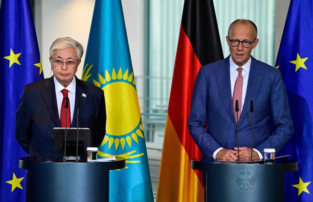 German Chancellor Friedrich Merz (R) and Kazakhstan's President Kassym-Jomart Tokayev address a press conference at the Chancellery in Berlin on September 29, 2026. (Photo by John MACDOUGALL / AFP)