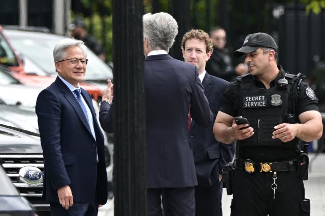 Nvidia CEO Jensen Huang (L) and Meta CEO Mark Zuckerberg (2R) arrive near the White House ahead of a planned meeting with US President Donald Trump, in Washington, DC, on September  29, 2026. Leading artificial intelligence executives will meet at the White House today with President Donald Trump as Congress calls for stronger industry oversight. The gathering comes quickly after tech giant OpenAI's cancellation of the release of its newest model due to safety concerns, and a series of revelations that the technology had gone rogue. (Photo by Oliver Contreras / AFP)