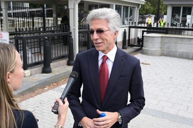 ServiceNow CEO Bill McDermott speaks to a reporter as he arrives near the White House ahead of a planned meeting with US President Donald Trump, in Washington, DC, on September  29, 2026. Leading artificial intelligence executives will meet at the White House today with President Donald Trump as Congress calls for stronger industry oversight. The gathering comes quickly after tech giant OpenAI's cancellation of the release of its newest model due to safety concerns, and a series of revelations that the technology had gone rogue. (Photo by Oliver Contreras / AFP)