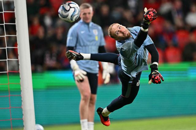 England's goalkeeper #23 Jason Steele dives for the ball during warm up prior to the UEFA Nations League Group A3 football match between the Czech Republic and England at Fortuna Arena in Prague on September 29, 2026. (Photo by Joe Klamar / AFP)