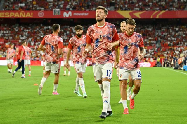 Croatia's midfielder #17 Petar Sucic and forward #19 Marco Pasalic jog before the start of the UEFA Nations League league phase group A3 football match between Spain and Croatia at Ramon Sanchez Pizjuan Stadium in Seville on September 29, 2026. (Photo by JAVIER SORIANO / AFP)