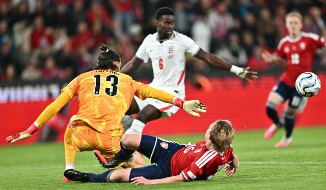 Czech Republic's midfielder #15 Pavel Sulc fails to score past England's goalkeeper #13 James Trafford (L) during the UEFA Nations League Group A3 football match between the Czech Republic and England at Fortuna Arena in Prague on September 29, 2026. (Photo by Joe Klamar / AFP)