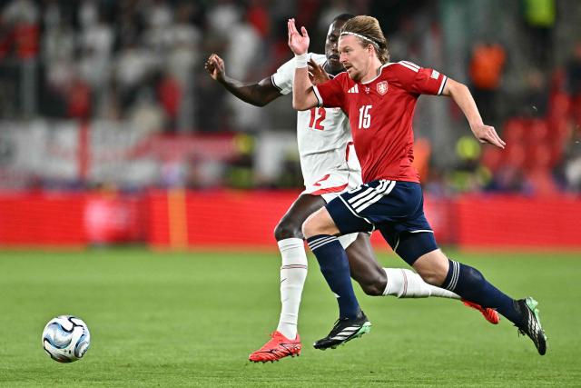 England's defender #12 Trevoh Chalobah and Czech Republic's midfielder #15 Pavel Sulc vie for the ball during the UEFA Nations League Group A3 football match between the Czech Republic and England at Fortuna Arena in Prague on September 29, 2026. (Photo by Joe Klamar / AFP)