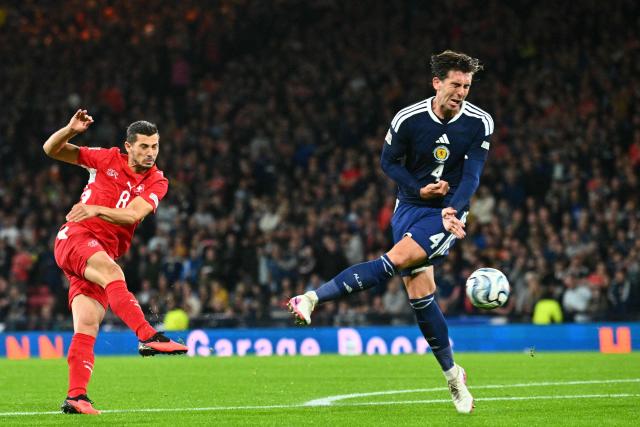 Switzerland's midfielder #08 Remo Freuler (L) shoots past Scotland's defender #04 Luis Binks (R) but fails to score during the UEFA Nations League, League B, Group 1 match football match between Scotland and Switzerland at Hampden Park in Glasgow, Scotland on September 29, 2026.  (Photo by ANDY BUCHANAN / AFP)