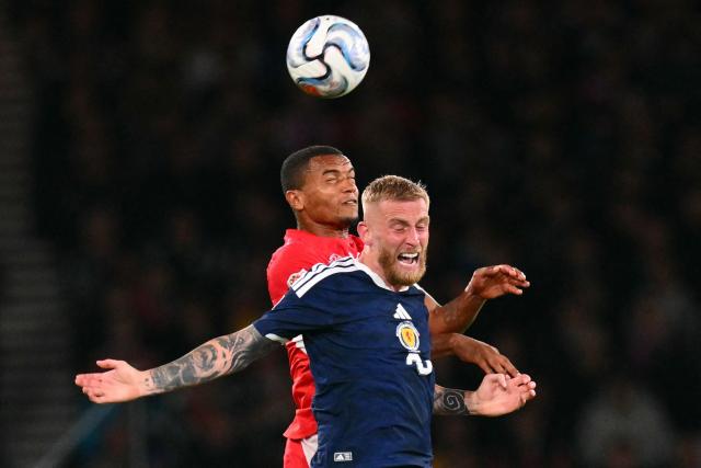 Switzerland's defender #05 Manuel Akanji (L) vies with Scotland's striker #09 Oliver McBurnie (R) during the UEFA Nations League, League B, Group 1 match football match between Scotland and Switzerland at Hampden Park in Glasgow, Scotland on September 29, 2026.  (Photo by ANDY BUCHANAN / AFP)