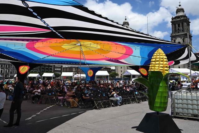 Attendees take part in cultural activities during the National Corn Day commemoration in Mexico City's Zocalo Square on September 29, 2026. The Mexican government, together with farmers, peasant organisations and civil society groups, is showcasing products derived from Mexico's 64 native maize varieties, considered a symbol of national identity and cultural heritage. (Photo by Yuri CORTEZ / AFP)