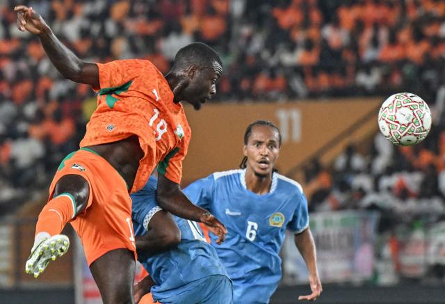 Ivory Coast's #19 Nicolas Pepe (L) heads the ball during the 2027 CAF African Cup of Nations (CAN) group C qualification match between Ivory Coast and Somalia at the Felix Houphouet-Boigny stadium in Abidjan, on September 29, 2026. (Photo by Issouf SANOGO / AFP)