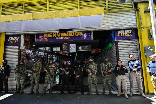 Members of the Mexican Navy stand guard during a joint operation with personnel from the Secretariat of Citizen Security and the Mexican Institute of Industrial Property to seize allegedly pirated goods at a shopping center in Mexico City on September 29, 2026. (Photo by Yuri CORTEZ / AFP)