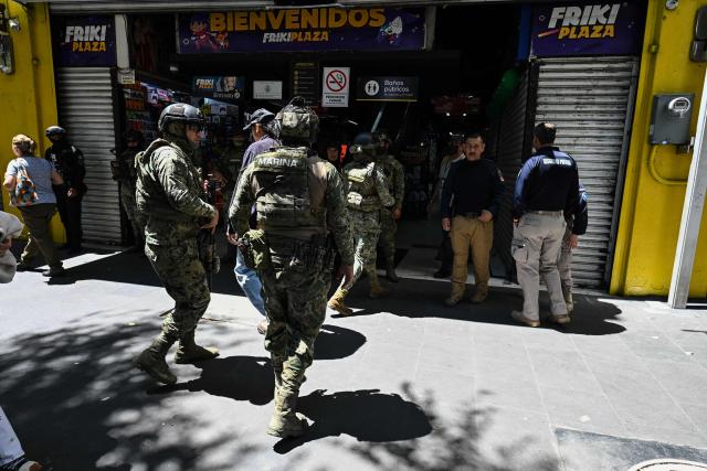 Members of the Mexican Navy take part in a joint operation with personnel from the Secretariat of Citizen Security and the Mexican Institute of Industrial Property to seize allegedly pirated goods at a shopping center in Mexico City on September 29, 2026. (Photo by Yuri CORTEZ / AFP)
