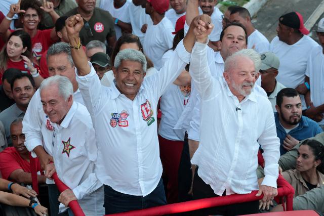 Brazil's President and presidential candidate Luiz Inacio Lula da Silva (R) and the governor of Bahia Jeronimo Rodrigues wave during a campaign rally in Salvador, Bahia state, Brazil on September 29, 2026. Brazil will hold presidential election on October 4, 2026. (Photo by ANTONELLO VENERI / AFP)