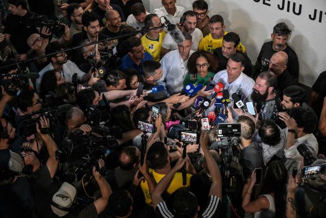 Brazil's right-wing senator and presidential candidate Flavio Bolsonaro of the Liberal Party (PL) speaks with journalists after meeting with jiu-jitsu practitioners at a gym during a campaign rally in Sao Paulo, Brazil, on September 29, 2026. Brazil will hold presidential election on October 4, 2026. (Photo by Nelson ALMEIDA / AFP)