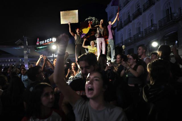 People gather at a protest camp against evictions and the housing crisis outside the headquarters of the Madrid regional government at Puerta del Sol in Madrid in the early hours of September 30, 2026. The Spanish government on September 29 approved measures including a ban on evictions until 2030 and the automatic renewal of tenant contracts following days of nationwide housing protests. But the measures hang in the balance as the left-wing coalition lacks a majority in a heavily fragmented parliament, which is due to vote on them on October 2. (Photo by Thomas COEX / AFP)