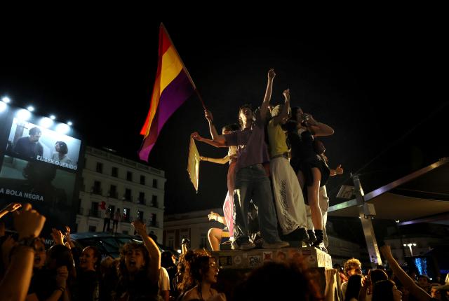 People gather at a protest camp against evictions and the housing crisis outside the headquarters of the Madrid regional government at Puerta del Sol in Madrid in the early hours of September 30, 2026. The Spanish government on September 29 approved measures including a ban on evictions until 2030 and the automatic renewal of tenant contracts following days of nationwide housing protests. But the measures hang in the balance as the left-wing coalition lacks a majority in a heavily fragmented parliament, which is due to vote on them on October 2. (Photo by Thomas COEX / AFP)