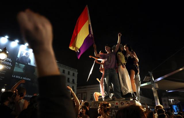 People gather at a protest camp against evictions and the housing crisis outside the headquarters of the Madrid regional government at Puerta del Sol in Madrid in the early hours of September 30, 2026. The Spanish government on September 29 approved measures including a ban on evictions until 2030 and the automatic renewal of tenant contracts following days of nationwide housing protests. But the measures hang in the balance as the left-wing coalition lacks a majority in a heavily fragmented parliament, which is due to vote on them on October 2. (Photo by Thomas COEX / AFP)