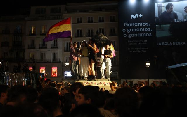 People gather at a protest camp against evictions and the housing crisis outside the headquarters of the Madrid regional government at Puerta del Sol in Madrid in the early hours of September 30, 2026. The Spanish government on September 29 approved measures including a ban on evictions until 2030 and the automatic renewal of tenant contracts following days of nationwide housing protests. But the measures hang in the balance as the left-wing coalition lacks a majority in a heavily fragmented parliament, which is due to vote on them on October 2. (Photo by Thomas COEX / AFP)