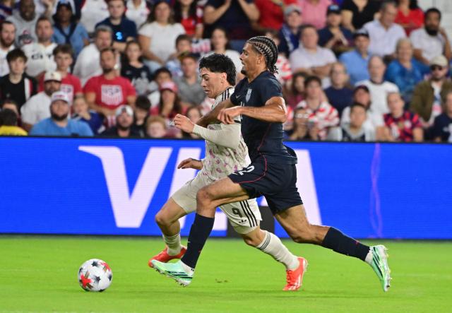 Chile's forward #09 Maximiliano Gutierrez and US defender #12 Miles Robinson vie for the ball during the international friendly football match between USA and Chile at Energizer Park in St. Louis, Missouri, on September 29, 2026. (Photo by TIM VIZER / AFP)