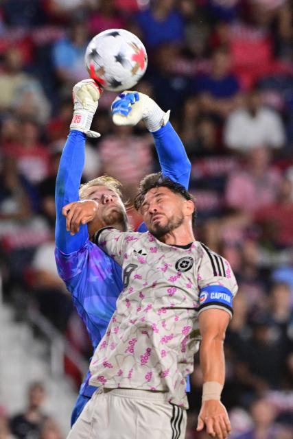 US goalkeeper #25 Chris Brady punches away a corner kick under pressure from Chile's defender #08 Felipe Loyola during the international friendly football match between USA and Chile at Energizer Park in St. Louis, Missouri, on September 29, 2026. (Photo by TIM VIZER / AFP)