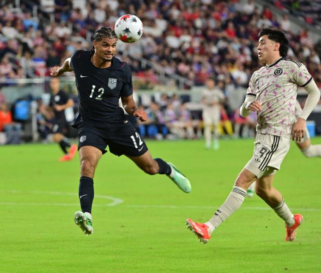 US defender #12 Miles Robinson heads the ball out of bounds to keep it away from Chile's forward #09 Maximiliano Gutierrez during the international friendly football match between USA and Chile at Energizer Park in St. Louis, Missouri, on September 29, 2026. (Photo by TIM VIZER / AFP)
