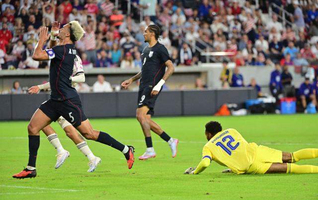 US defender #05 Antonee Robinson reacts after his second half shot on goal was deflected by Chile's goalkeeper #12 Lawrence Vigouroux during the international friendly football match between USA and Chile at Energizer Park in St. Louis, Missouri, on September 29, 2026. (Photo by TIM VIZER / AFP)