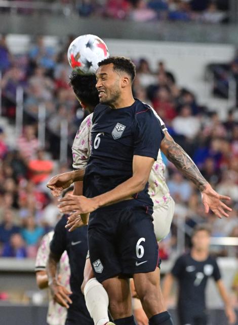 US defender #06 Auston Trusty and Chile's defender #26 Diego Ulloa vie for a header during the international friendly football match between USA and Chile at Energizer Park in St. Louis, Missouri, on September 29, 2026. (Photo by TIM VIZER / AFP)