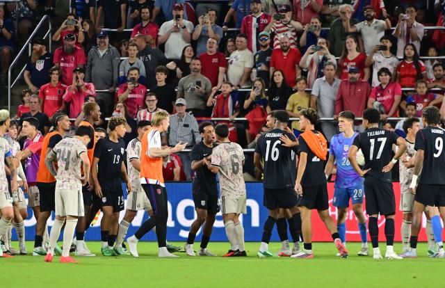 Chile and US players tangle in a bench-clearing pushing match during the international friendly football match between USA and Chile at Energizer Park in St. Louis, Missouri, on September 29, 2026. (Photo by TIM VIZER / AFP)