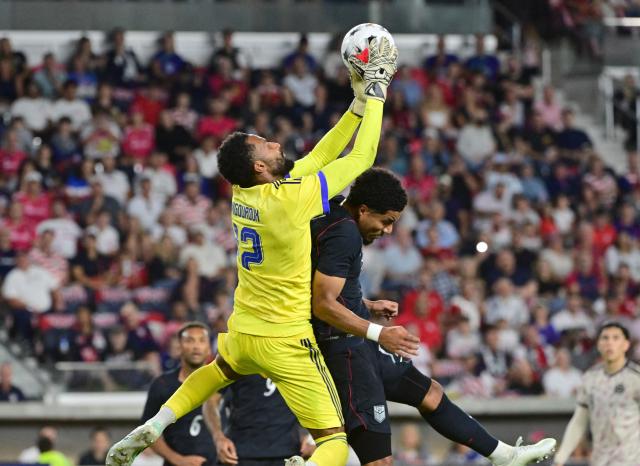 Chile's goalkeeper #12 Lawrence Vigouroux and US midfielder #17 Malik Tillman collide in the second half during the international friendly football match between USA and Chile at Energizer Park in St. Louis, Missouri, on September 29, 2026. (Photo by TIM VIZER / AFP)